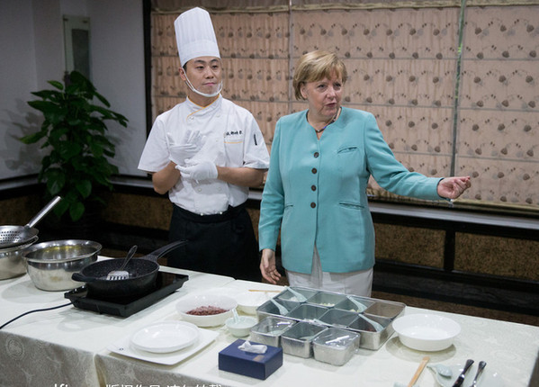 默克爾學做宮保雞丁的寓意:到中國西部做點什么